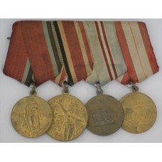 Group of 4 Soviet era commemorative medals for WWII veteran 