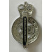 H M Prisons cap badge